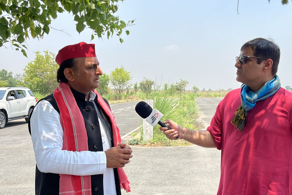 Samajwadi Party chief Akhilesh Yadav standing with Rohan Dua