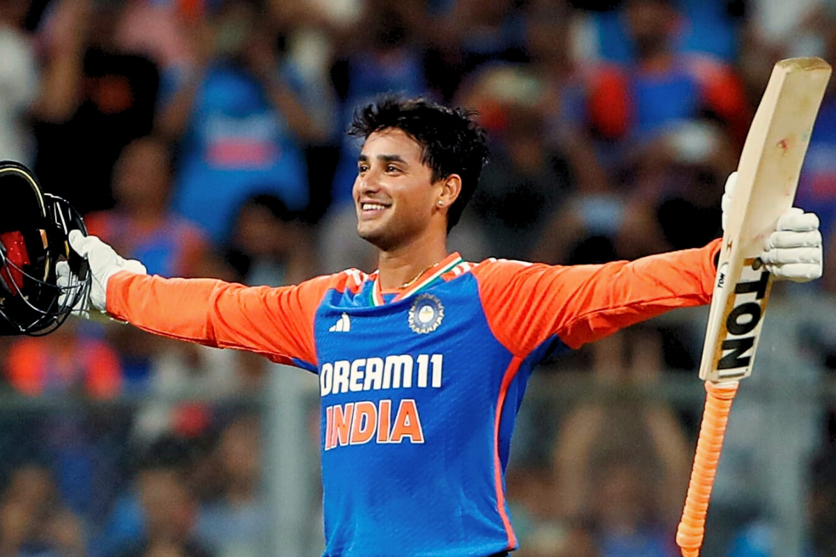 Abhishek Sharma celebrates his century against England with a jubilant gesture at Wankhede Stadium.