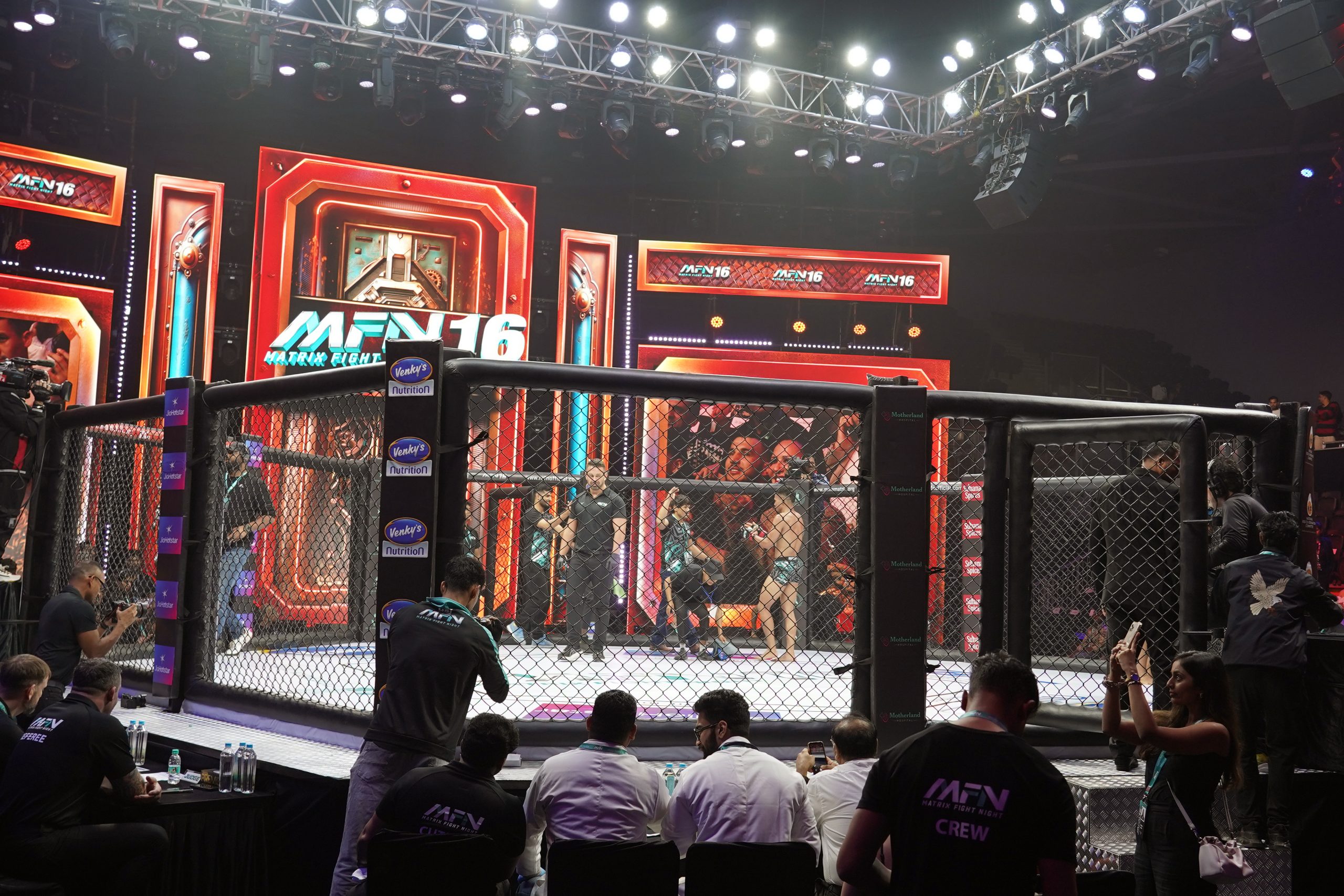 The fights took place in an enclosed cage, a standard feature in MMA events. (Photo by Ritik Sharma)